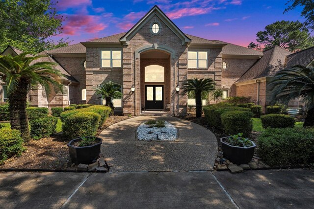 12710 Everhart Pointe Dr, Tomball, TX 77377 - view of front of house featuring brick siding and french doors