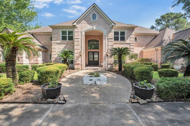 12710 Everhart Pointe Dr, Tomball, TX 77377 - view of front facade featuring brick siding and a shingled roof