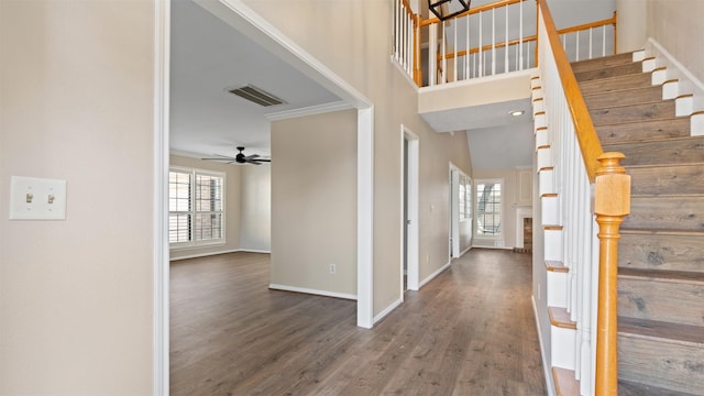 16902 River Willow Dr, Spring, TX 77379 - entryway with wood finished floors, baseboards, ceiling fan, stairway, and ornamental molding