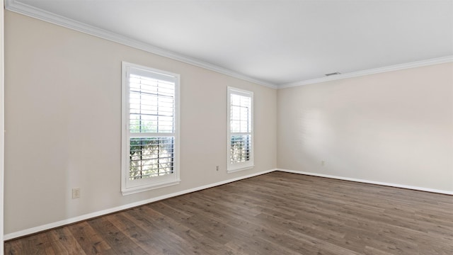 16902 River Willow Dr, Spring, TX 77379 - spare room featuring ornamental molding, dark wood-style flooring, and baseboards