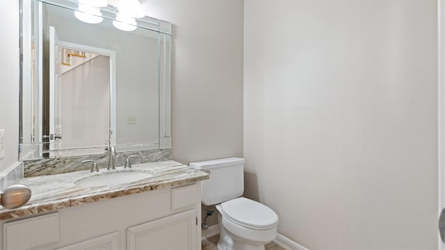 16902 River Willow Dr, Spring, TX 77379 - bathroom with toilet, vanity, and baseboards