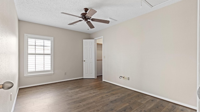 16902 River Willow Dr, Spring, TX 77379 - unfurnished bedroom with wood finished floors, baseboards, attic access, a textured ceiling, and ceiling fan