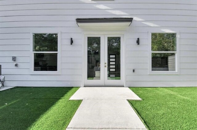 6541 Sealey St, Houston, TX 77091 - doorway to property featuring french doors and a lawn
