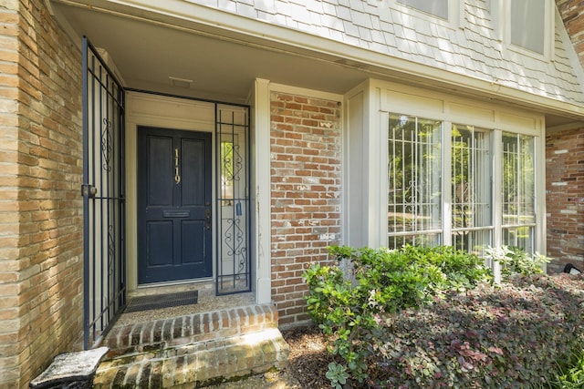1119 Fountain View Dr Unit 49, Houston, TX 77057 - view of exterior entry featuring brick siding