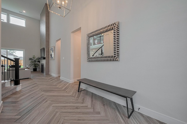 27807 Bridgeway St, Spring, TX 77386 - hall featuring baseboards, a high ceiling, a chandelier, stairs, and recessed lighting