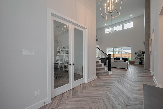 27807 Bridgeway St, Spring, TX 77386 - foyer with baseboards, a chandelier, french doors, a towering ceiling, and stairs
