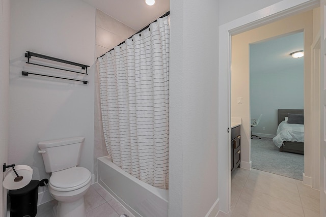 27807 Bridgeway St, Spring, TX 77386 - bathroom featuring tile patterned flooring, toilet, shower / bath combination with curtain, vanity, and baseboards