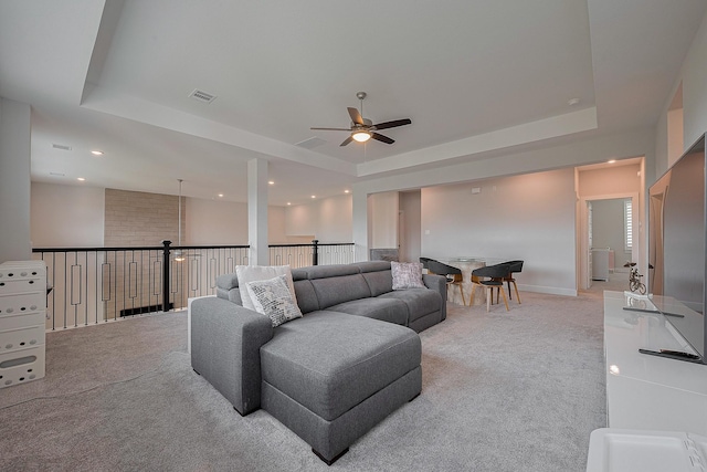 27807 Bridgeway St, Spring, TX 77386 - living area with light colored carpet, a tray ceiling, a ceiling fan, and recessed lighting