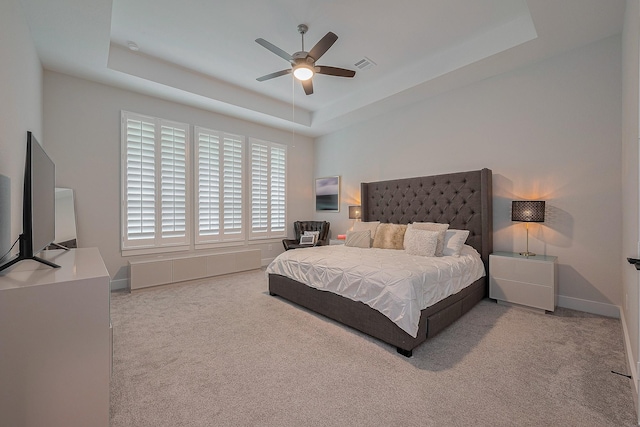 27807 Bridgeway St, Spring, TX 77386 - carpeted bedroom with a tray ceiling, baseboards, and ceiling fan