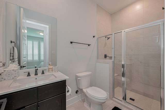 27807 Bridgeway St, Spring, TX 77386 - full bathroom with a shower stall, toilet, vanity, tile patterned floors, and baseboards