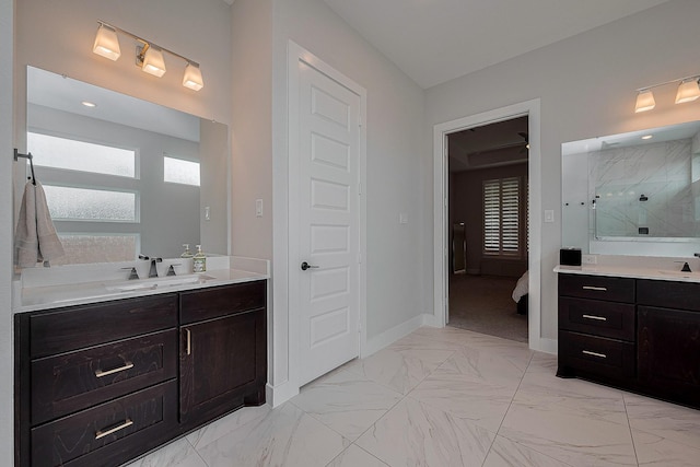 27807 Bridgeway St, Spring, TX 77386 - bathroom with a stall shower, two vanities, marble finish floors, and baseboards