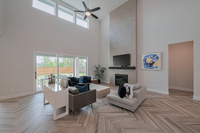27807 Bridgeway St, Spring, TX 77386 - living area with a towering ceiling, a ceiling fan, healthy amount of natural light, and baseboards