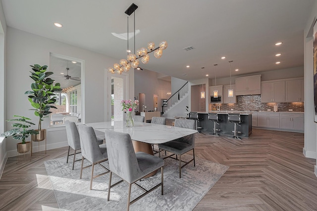 27807 Bridgeway St, Spring, TX 77386 - dining room with stairs, a ceiling fan, recessed lighting, and baseboards