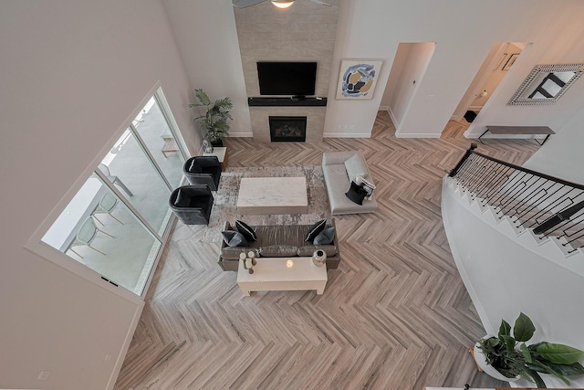 27807 Bridgeway St, Spring, TX 77386 - living room featuring a fireplace and baseboards