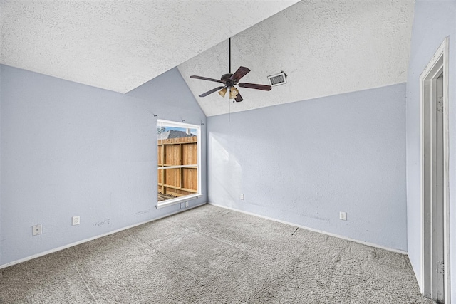 17607 Northfalk Dr, Houston, TX 77084 - carpeted spare room with a textured ceiling, ceiling fan, lofted ceiling, baseboards, and a textured wall
