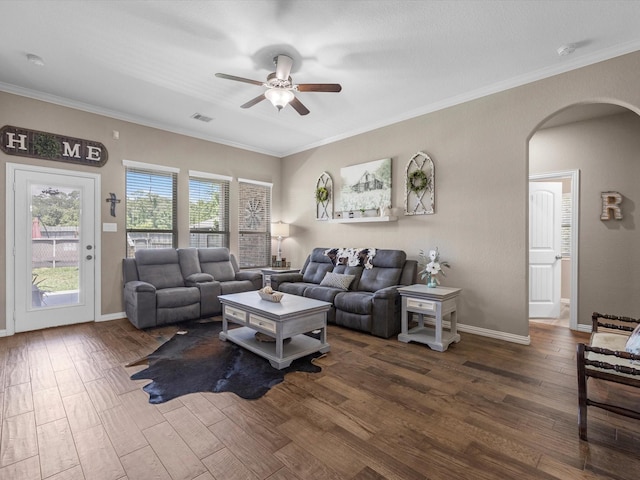 1326 Tee Time Ct, Crosby, TX 77532 - living area with arched walkways, a ceiling fan, wood finished floors, crown molding, and baseboards