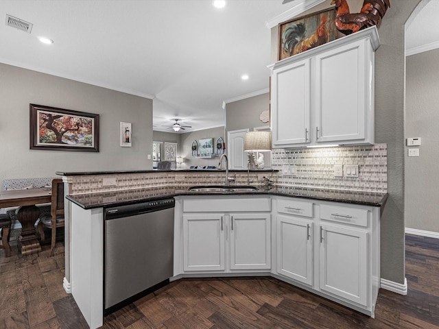 1326 Tee Time Ct, Crosby, TX 77532 - kitchen with dishwasher, a sink, dark wood-style flooring, crown molding, and white cabinets