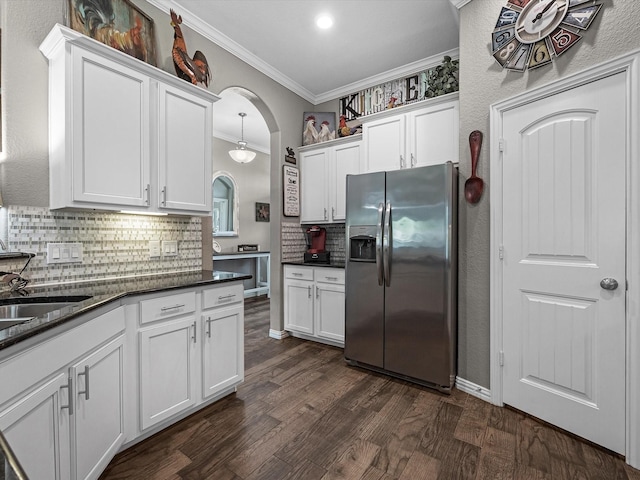 1326 Tee Time Ct, Crosby, TX 77532 - kitchen with stainless steel refrigerator with ice dispenser, crown molding, white cabinets, decorative backsplash, and dark wood finished floors
