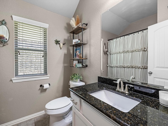 1326 Tee Time Ct, Crosby, TX 77532 - bathroom with vanity, vaulted ceiling, toilet, a textured wall, and tile patterned flooring
