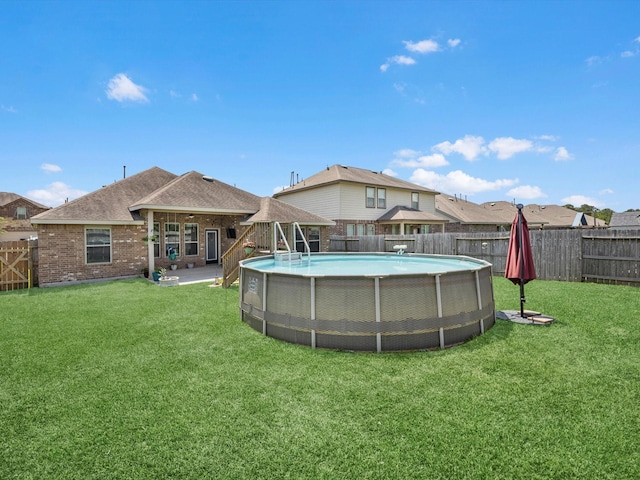 1326 Tee Time Ct, Crosby, TX 77532 - back of house featuring brick siding, a gazebo, and roof with shingles