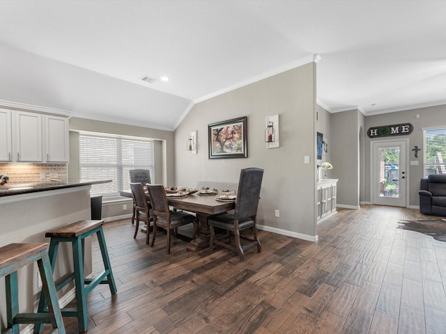 1326 Tee Time Ct, Crosby, TX 77532 - dining space featuring dark wood-style flooring, baseboards, crown molding, and lofted ceiling
