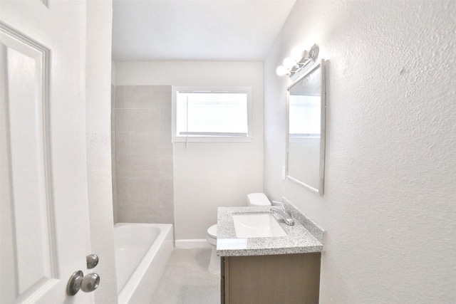 6534 Ledbetter St, Houston, TX 77087 - full bath featuring vanity, toilet, a textured wall, and baseboards