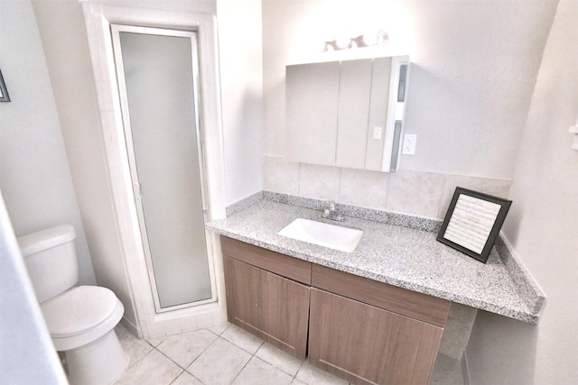 6534 Ledbetter St, Houston, TX 77087 - bathroom with toilet, a stall shower, vanity, and tile patterned floors
