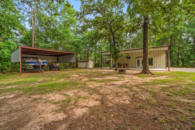 51 Roatan Dr, Point Blank, TX 77364 - view of yard featuring an outbuilding, a shed, and view of scattered trees