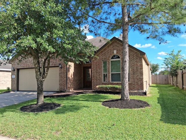 24911 Tribeca Ln, Katy, TX 77493 - view of front of home with concrete driveway, a garage, and brick siding