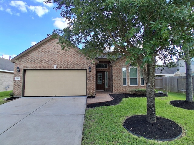 24911 Tribeca Ln, Katy, TX 77493 - view of front of house with driveway, an attached garage, and brick siding