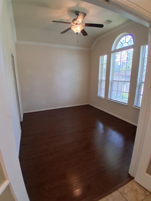 24911 Tribeca Ln, Katy, TX 77493 - spare room with crown molding, wood finished floors, ceiling fan, and baseboards