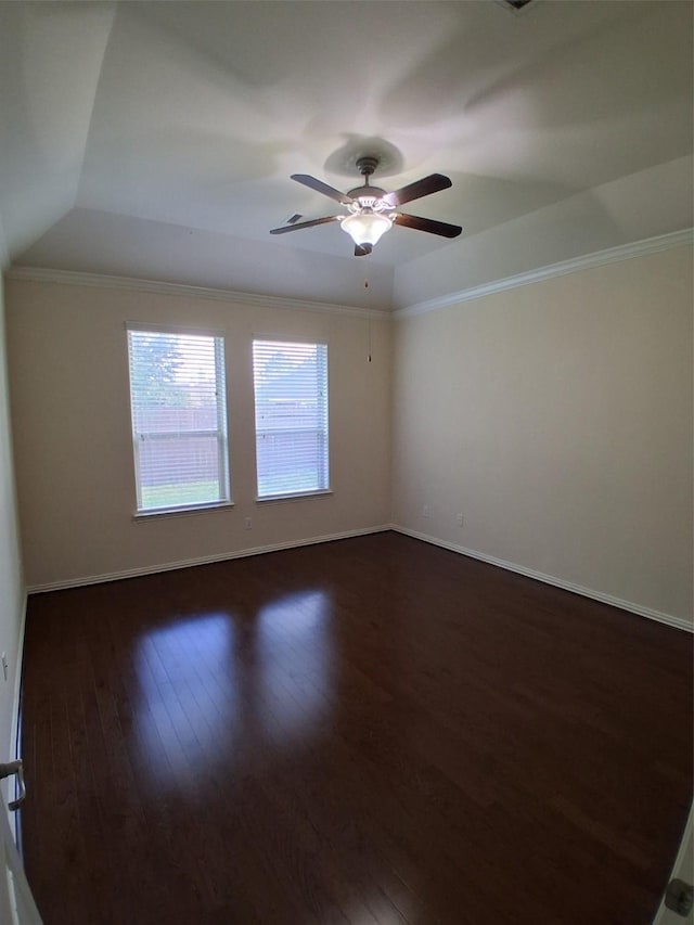 24911 Tribeca Ln, Katy, TX 77493 - spare room with dark wood-type flooring, a raised ceiling, baseboards, ceiling fan, and crown molding