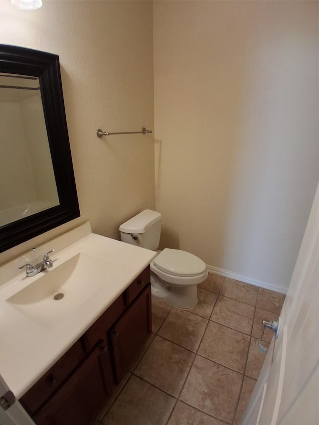 24911 Tribeca Ln, Katy, TX 77493 - bathroom with toilet, vanity, and tile patterned floors