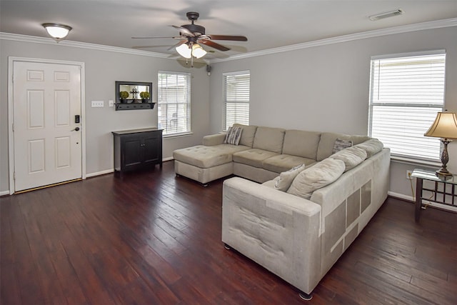 living area with a ceiling fan, dark wood-type flooring, ornamental molding, and baseboards