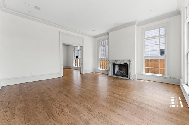 6104 San Felipe St, Houston, TX 77057 - unfurnished living room featuring a premium fireplace, crown molding, wood finished floors, and baseboards