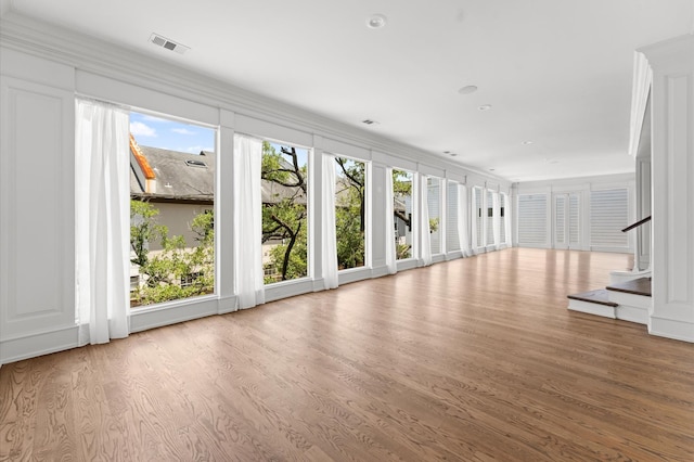 6104 San Felipe St, Houston, TX 77057 - unfurnished living room featuring wood finished floors and stairs