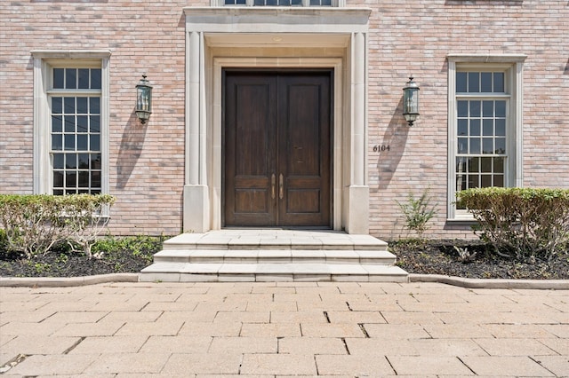 6104 San Felipe St, Houston, TX 77057 - doorway to property featuring brick siding