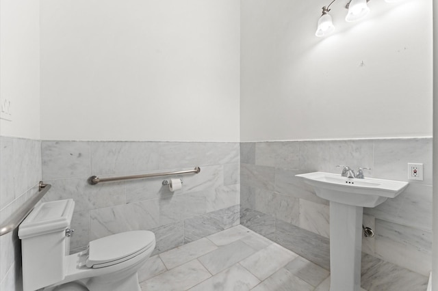 6104 San Felipe St, Houston, TX 77057 - half bathroom with toilet, tile walls, and wainscoting