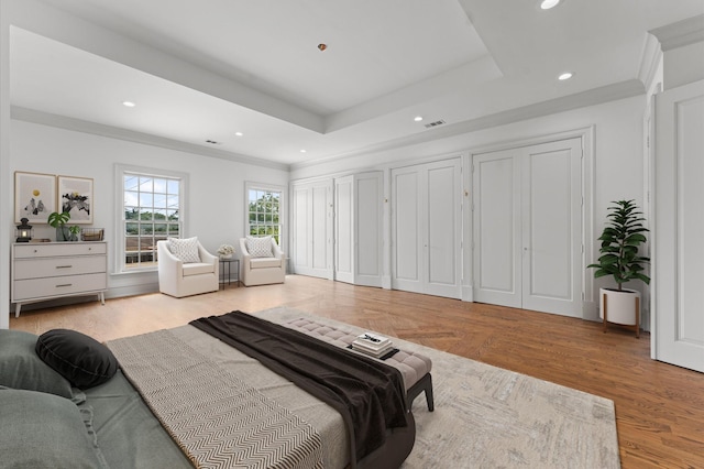 6104 San Felipe St, Houston, TX 77057 - bedroom with recessed lighting, a tray ceiling, two closets, and ornamental molding