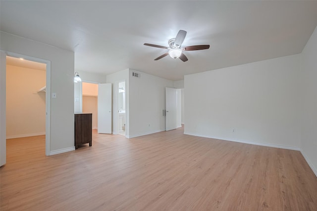 13040 Trail Hollow Dr Unit 3040, Houston, TX 77079 - spare room featuring ceiling fan, light wood finished floors, and baseboards