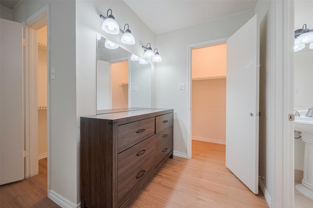 13040 Trail Hollow Dr Unit 3040, Houston, TX 77079 - bathroom with wood finished floors and baseboards