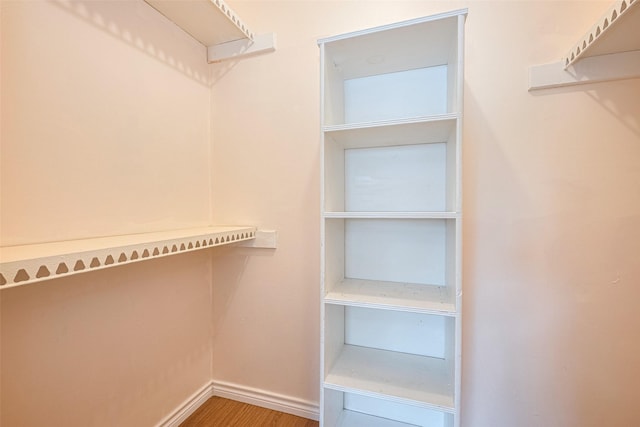 13040 Trail Hollow Dr Unit 3040, Houston, TX 77079 - walk in closet with wood finished floors