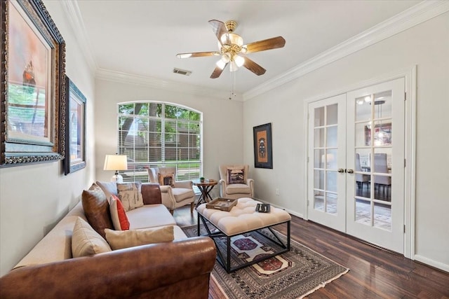 living area featuring french doors, ornamental molding, dark wood-type flooring, a ceiling fan, and baseboards