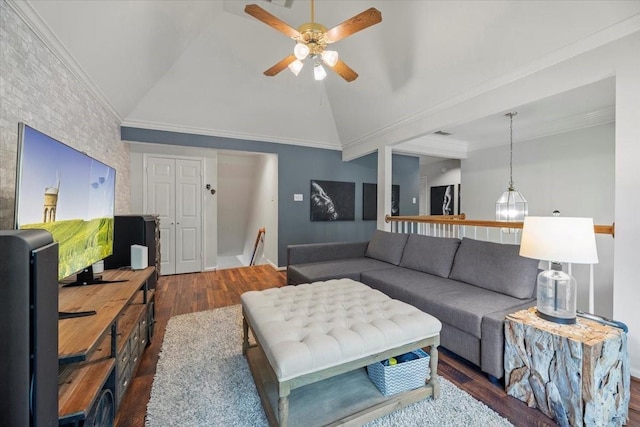 living area with wood finished floors, a ceiling fan, vaulted ceiling, and ornamental molding
