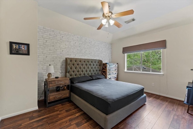 bedroom with dark wood-style flooring, baseboards, and a ceiling fan