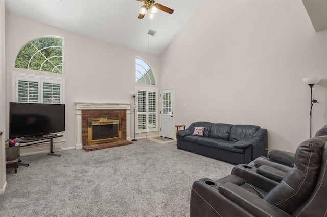 1409 Cherokee St, Deer Park, TX 77536 - carpeted living room with high vaulted ceiling, ceiling fan, a brick fireplace, and baseboards