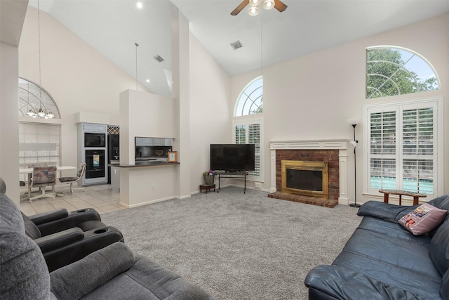 1409 Cherokee St, Deer Park, TX 77536 - living room featuring high vaulted ceiling, a fireplace, a ceiling fan, light colored carpet, and baseboards