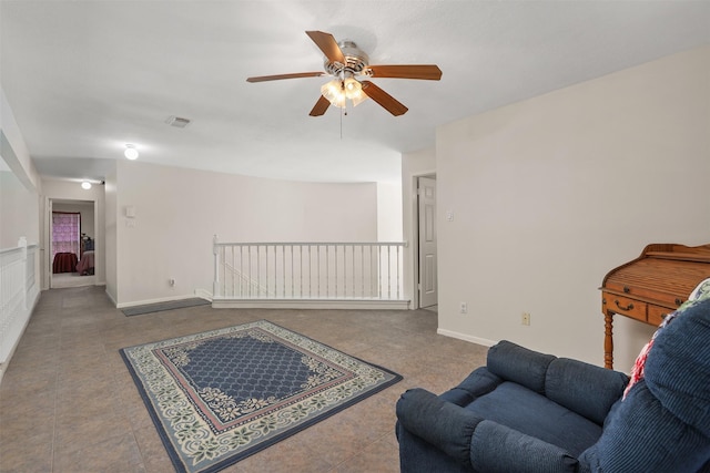 1409 Cherokee St, Deer Park, TX 77536 - living area with a ceiling fan, tile patterned floors, and baseboards
