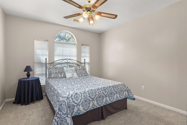 1409 Cherokee St, Deer Park, TX 77536 - carpeted bedroom with baseboards and a ceiling fan