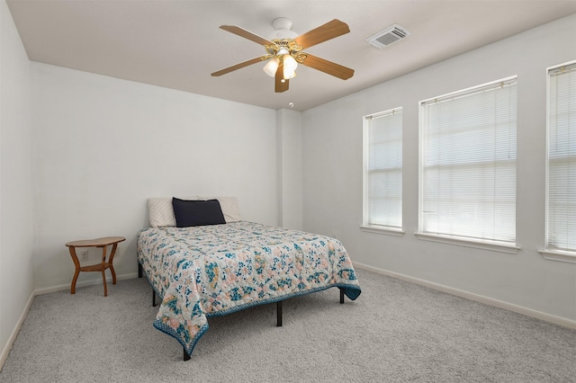 1409 Cherokee St, Deer Park, TX 77536 - carpeted bedroom with baseboards and a ceiling fan